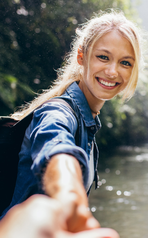 woman outdoors leading camera person