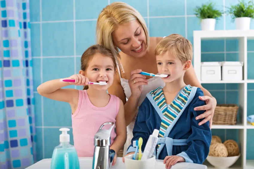 mom-brushing-kids-teeth